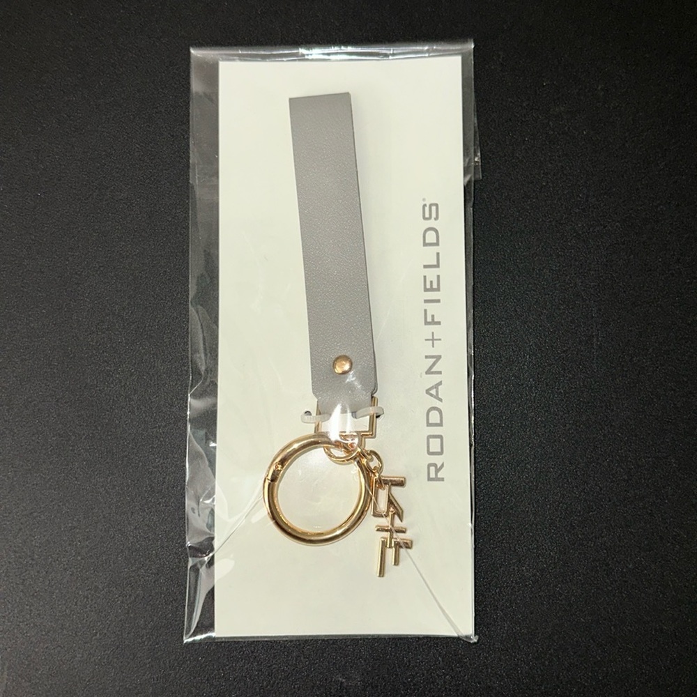 Rodan + Fields keychain wristlet